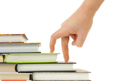 Hand and book stairs